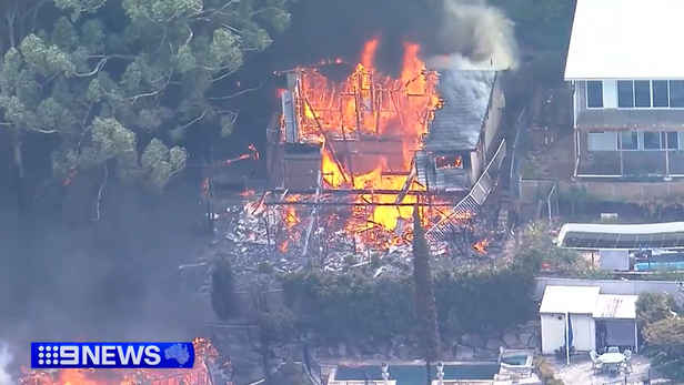 'Everything's gone': Wind change could worsen horror fires as 12 homes are destroyed