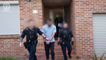 Man charged with terrorism offence after traffic stop leads to raid on Sydney home