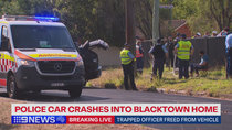 Police officer trapped in vehicle following two-car crash in Sydney's west 