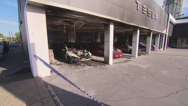 Three cars destroyed after suspected arson attack at Sydney Tesla dealership