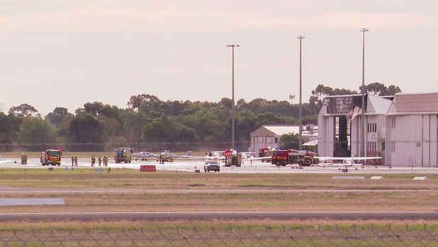 Two dead, 10 rushed to hospital after light plane crashes through hangar roof