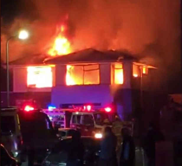 Woman charged with murder after man killed, another critically injured in fire